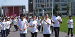 young people carrying Olympic torch