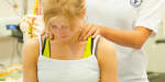 female athlete receiving shoulder massage